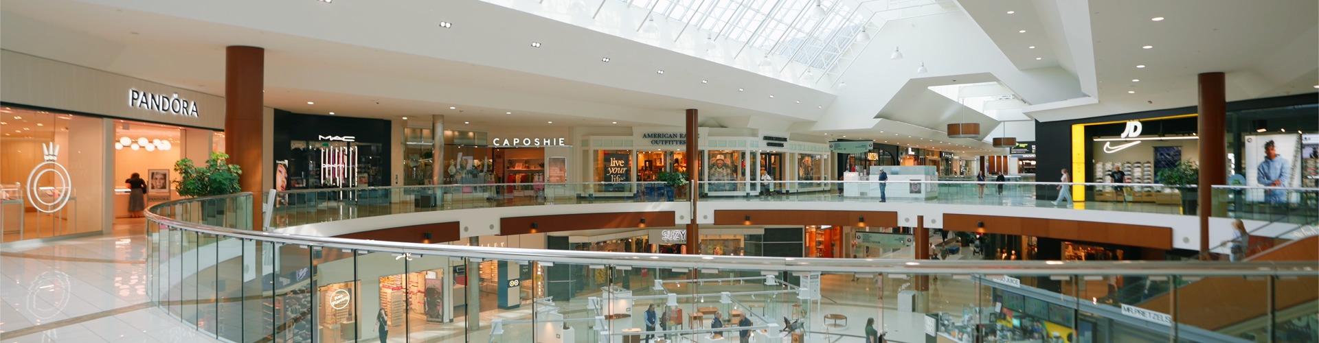 Two-level mall with Pandora, MAC and JD stores under a skylight