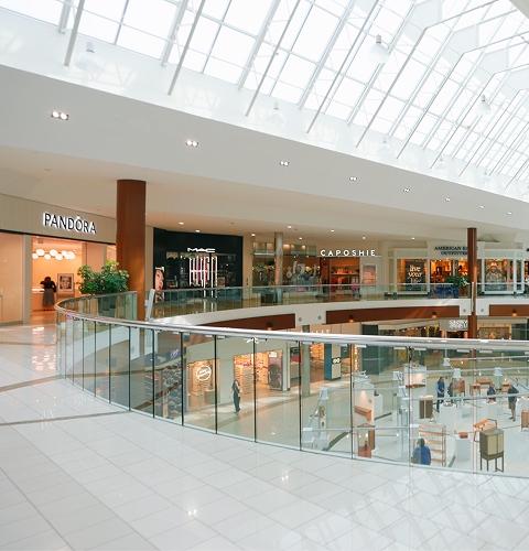 Two-level mall with Pandora, MAC and JD stores under a skylight