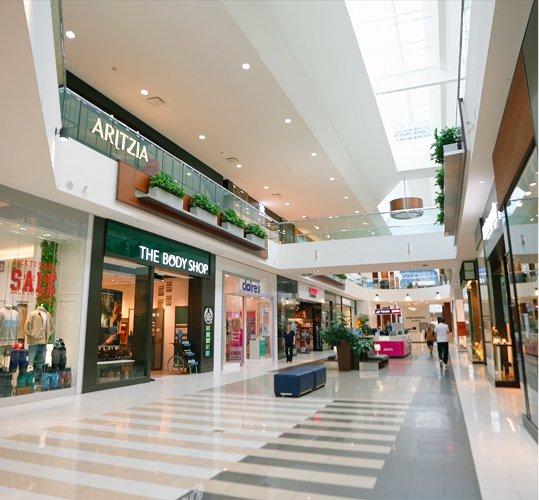 Bright two-level mall with Aritzia, The Body Shop and Claire's stores