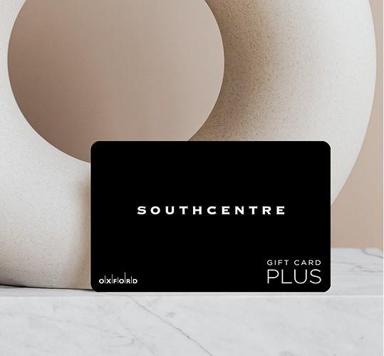 Black Southcentre Plus gift card leaning against a white sculpture on marble