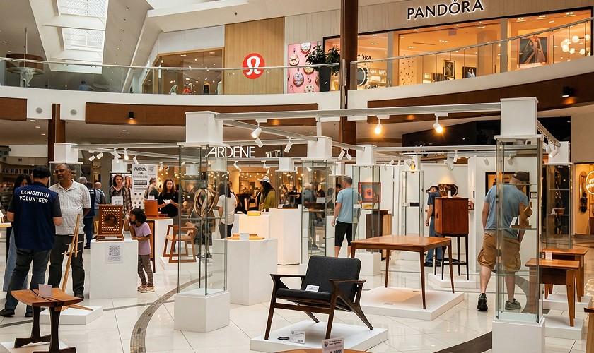 Furniture design exhibition on white plinths in the mall below Pandora