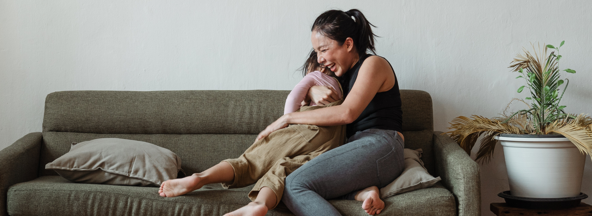 Mother tightly hugging daughter