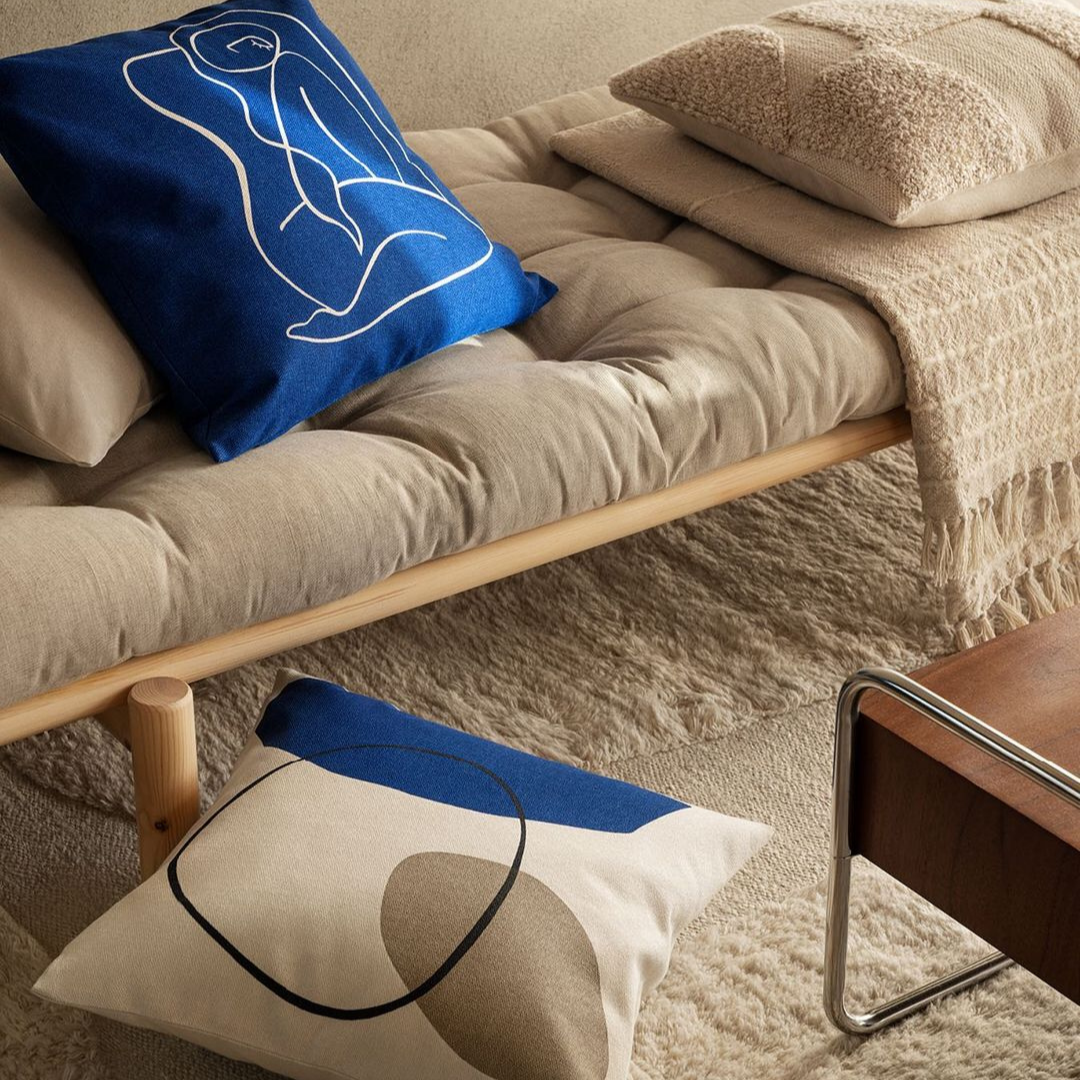 Contemporary Line work inspired pillow accents in blue and cream