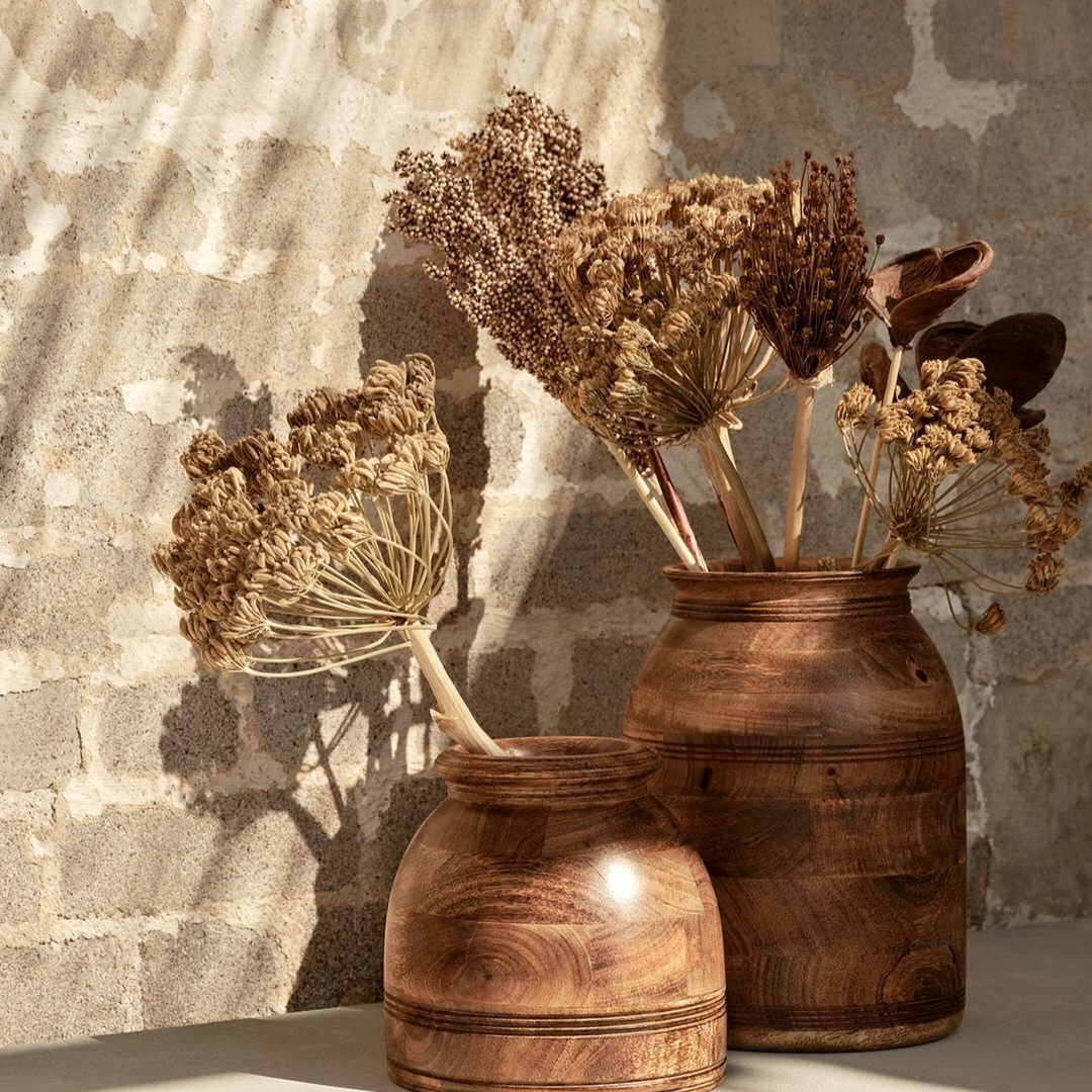 Dried flowers in two wooden vases