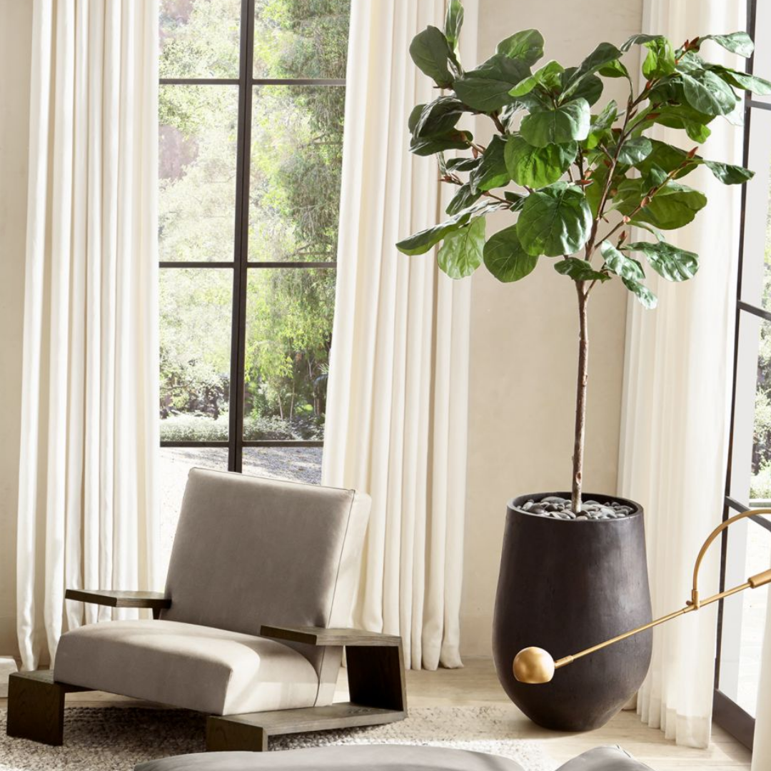 Faux plant in a black clay pot