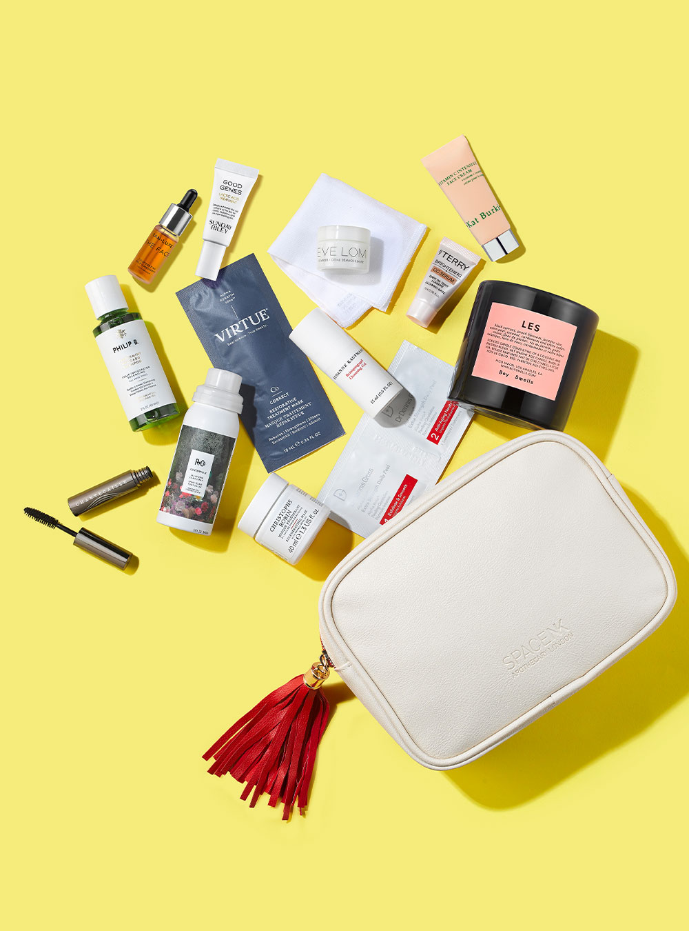 Various Hudson's Bay beauty products are spread out on a light yellow background.