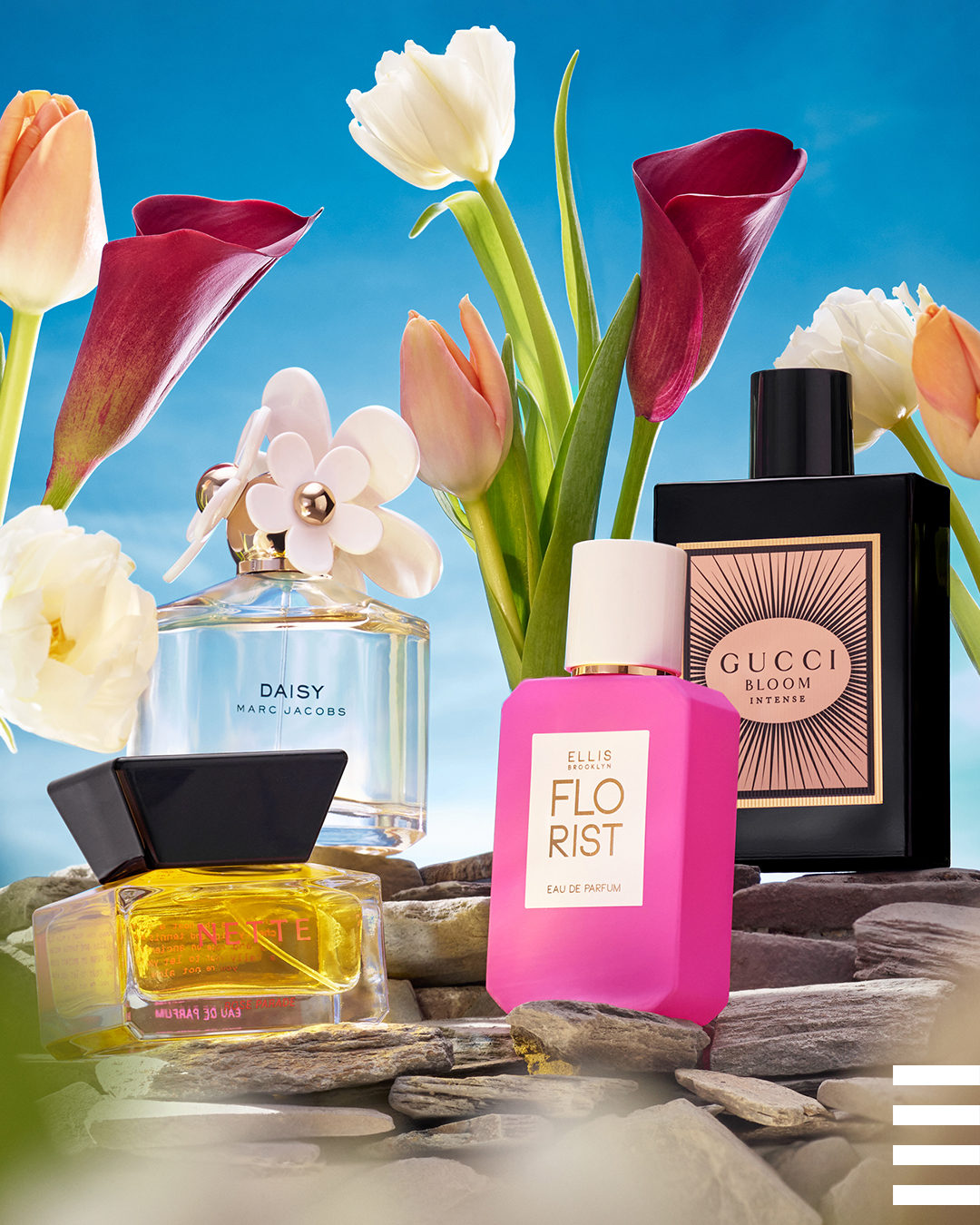 Four perfumes from Sephora are featured alongside beautiful spring flowers.