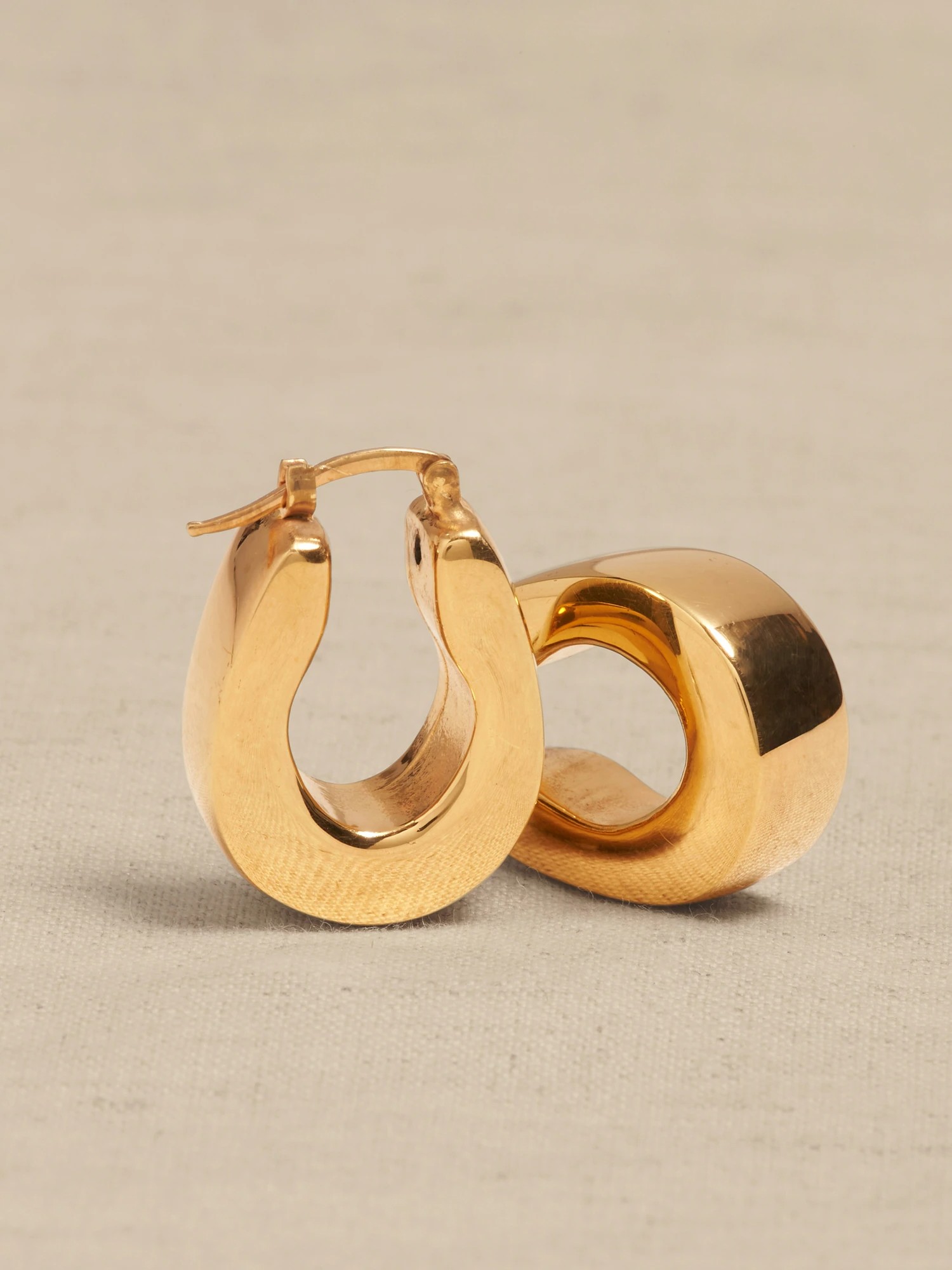 image of gold sculptural earrings