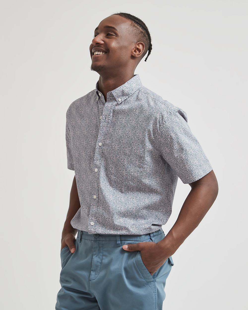 image of a model wearing a short sleeve button up paisley shirt