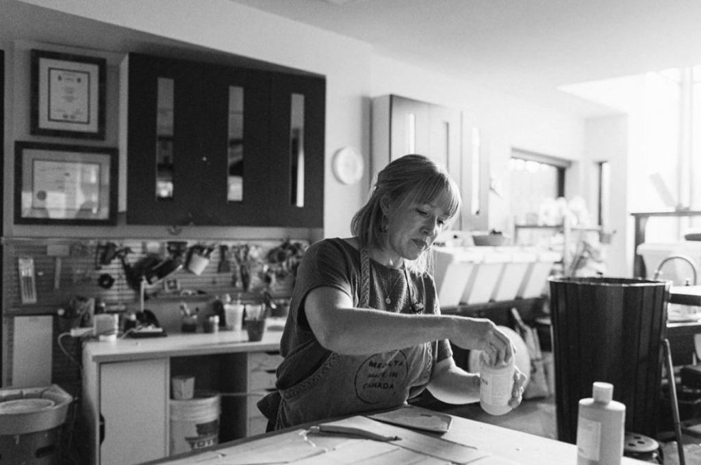 Juliana Rempel pouring a jar into a container