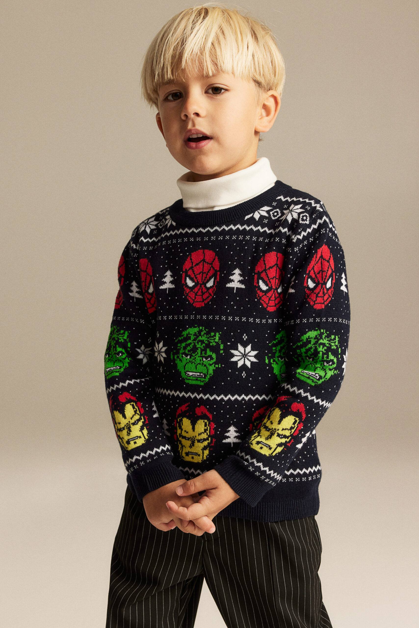 boy wearing knit cotton sweater with spiderman the hulk and spider man graphics