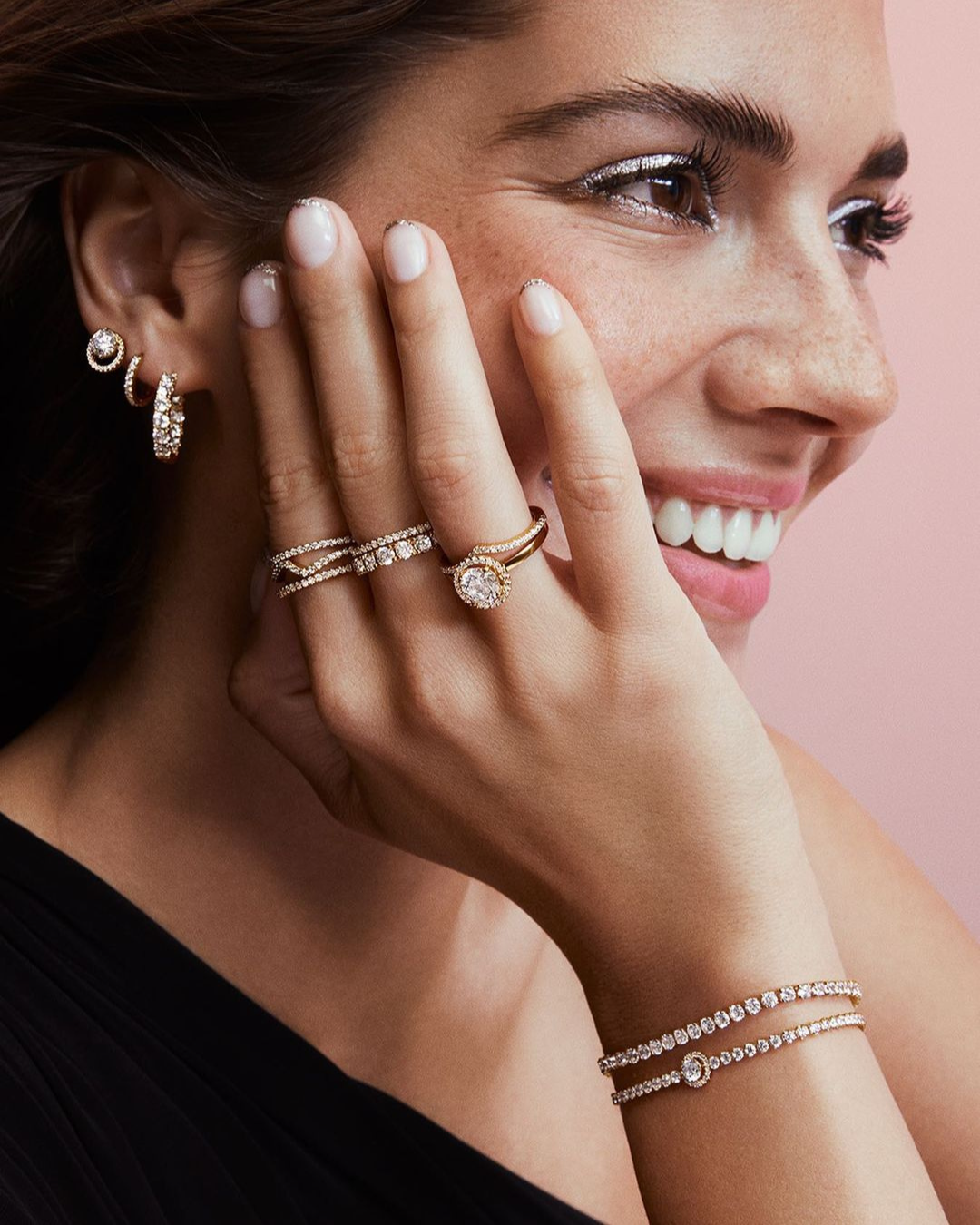 a person wearing jewelry and smiling