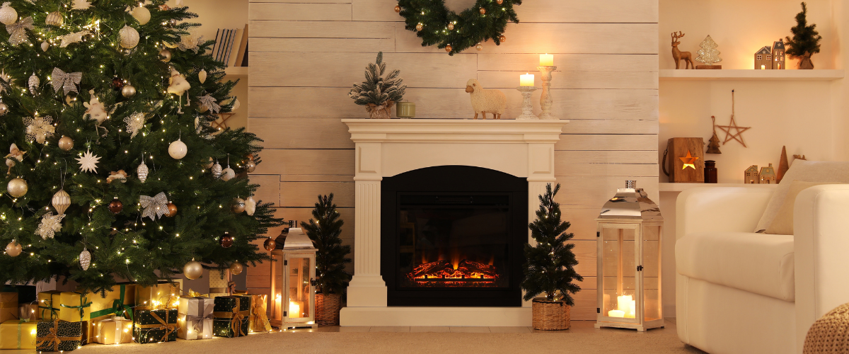 a fireplace with a sheep on top and candles and a wreath on the wall
