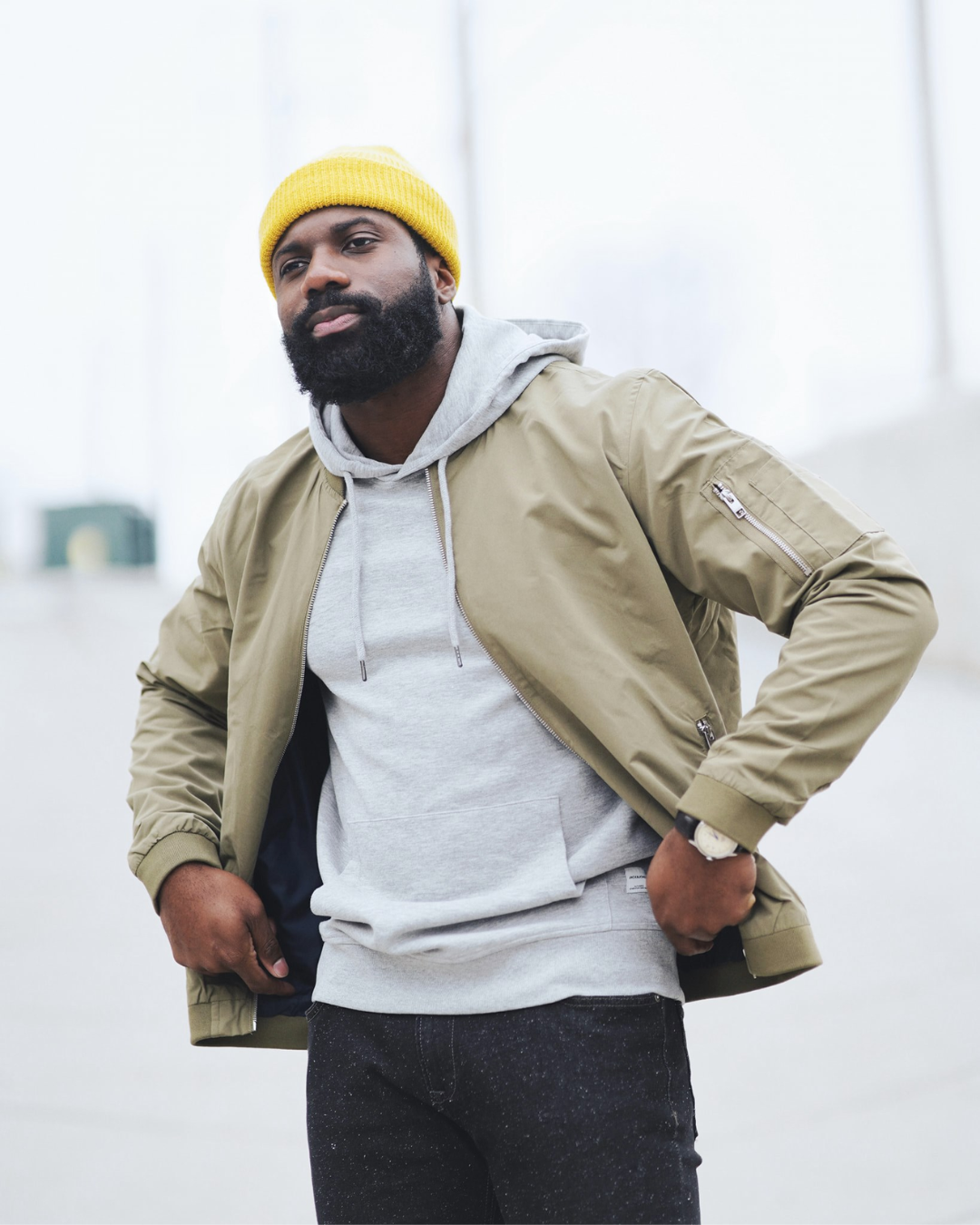 a person in a yellow beanie and jacket
