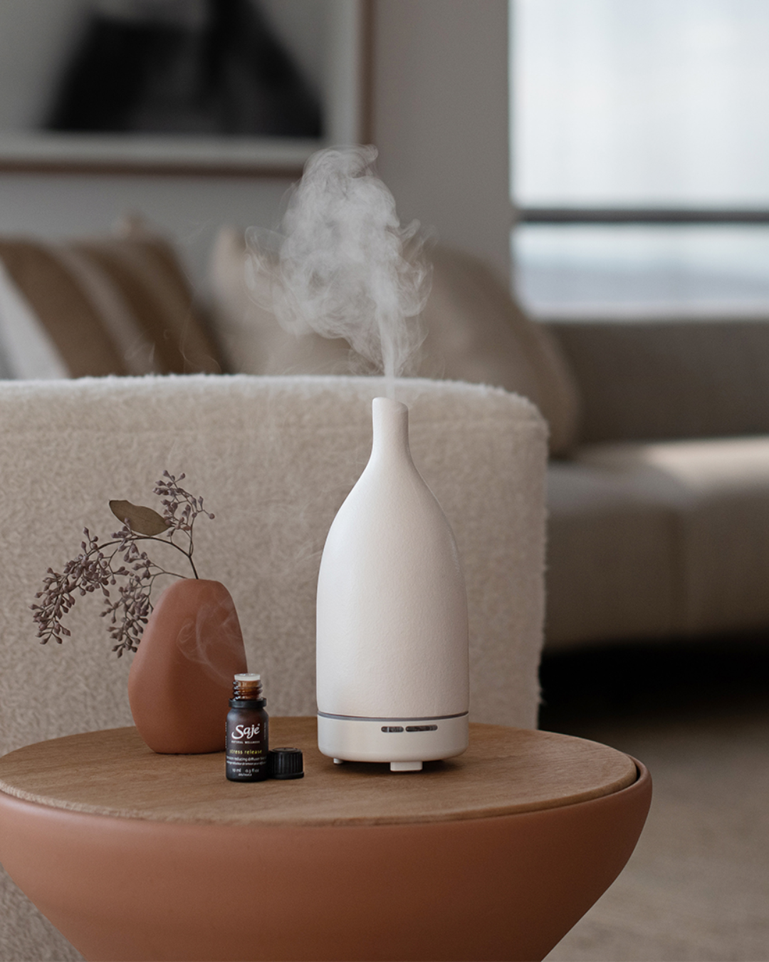 A white aroma diffuser on a table.