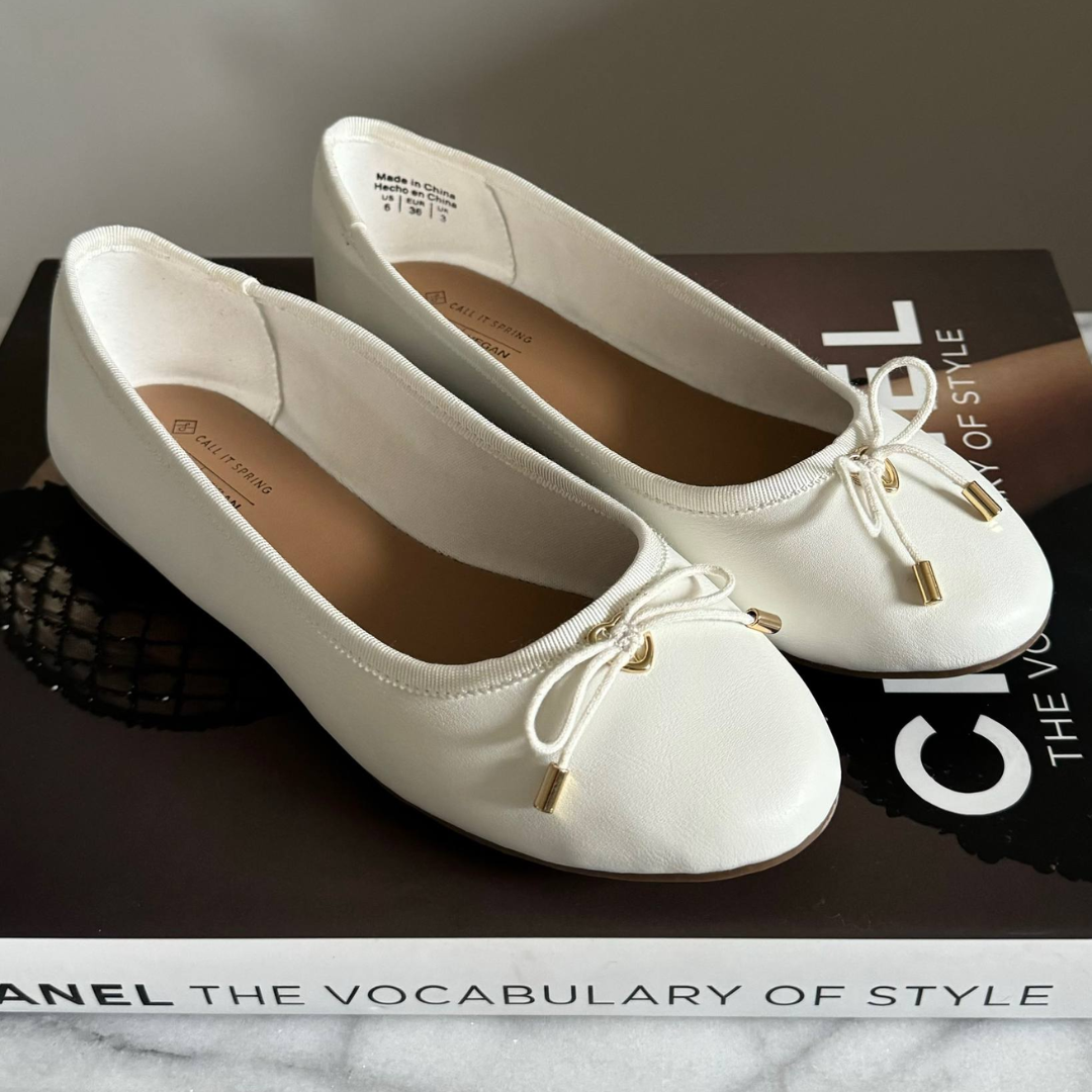 White ballet flats with bow details