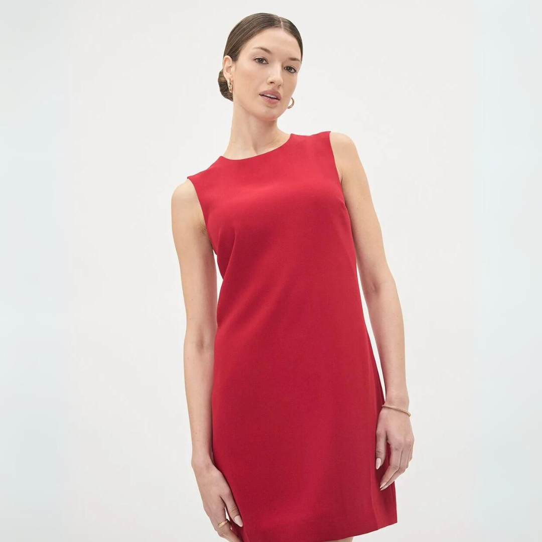 Woman wearing a red sleeveless dress from RW&CO