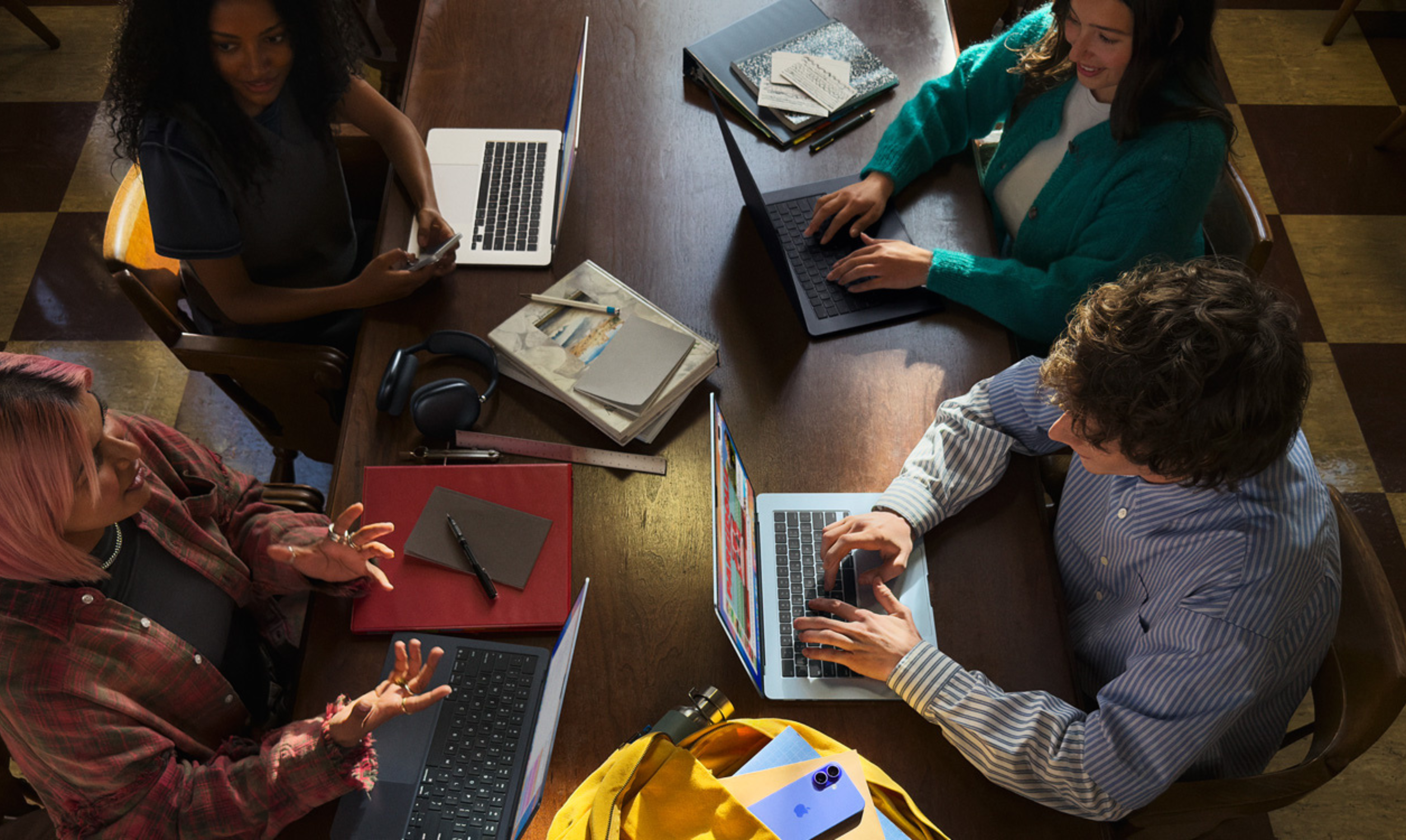 students sitting at table studying